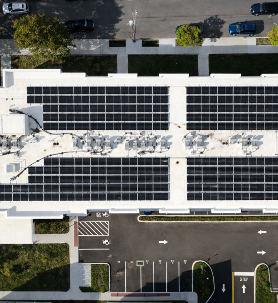 Solar panel-equipped building with parking lot